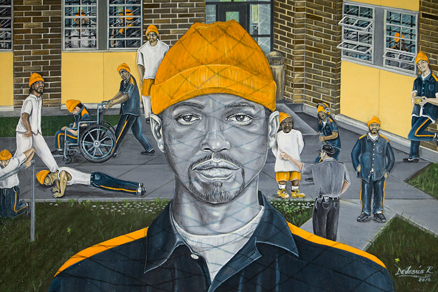 Color drawing of male prisoner in prison yard, with chain-link shadow across his face