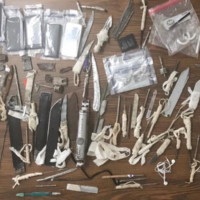 Photo of knives, cash, and other contraband