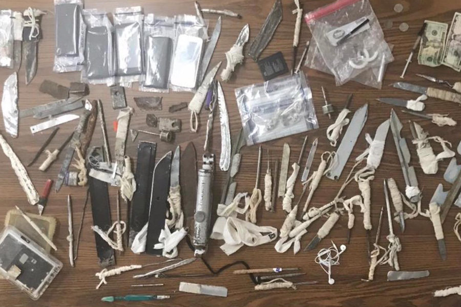 Photo of knives, cash, and other contraband