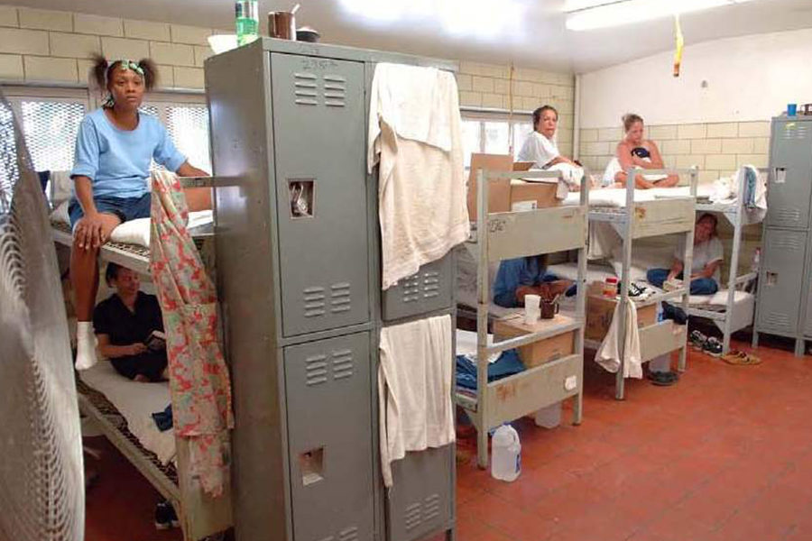 Color photo: Crowded women's prison dorm