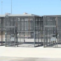 Empty solitary cages in prison yard