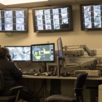 Jail staff monitors security camera footage