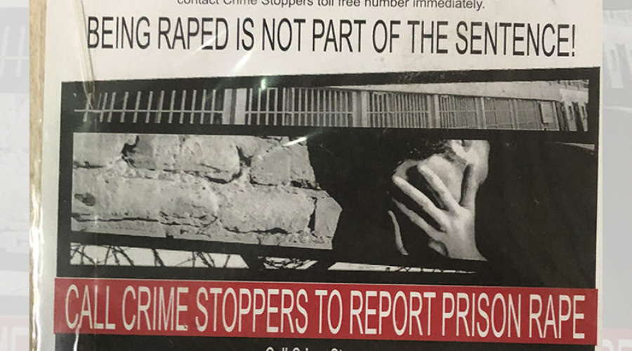 PREA poster from Louisiana State Penitentiary, Angola, that reads "call crime stoppers to report prison rape" and "being raped is not part of the sentence!" the photo is mostly in black and white with big white letters against a bold red background.